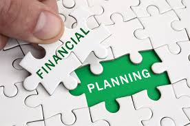 White puzzle showing the words financial planning in green