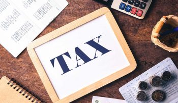 Tax image with money, calculator and receipts